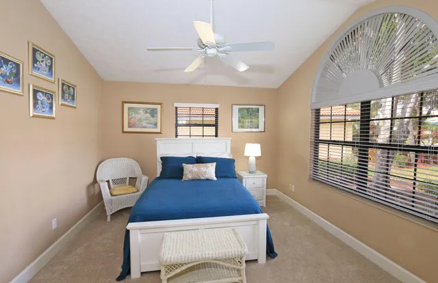 a view of a house with pool and sitting area