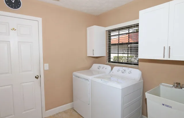 an aerial view of residential houses with yard