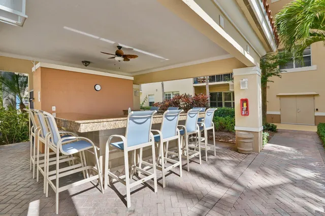 a view of a backyard with sitting area
