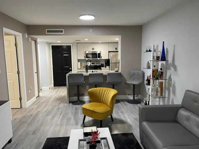 a living room with furniture and a rug