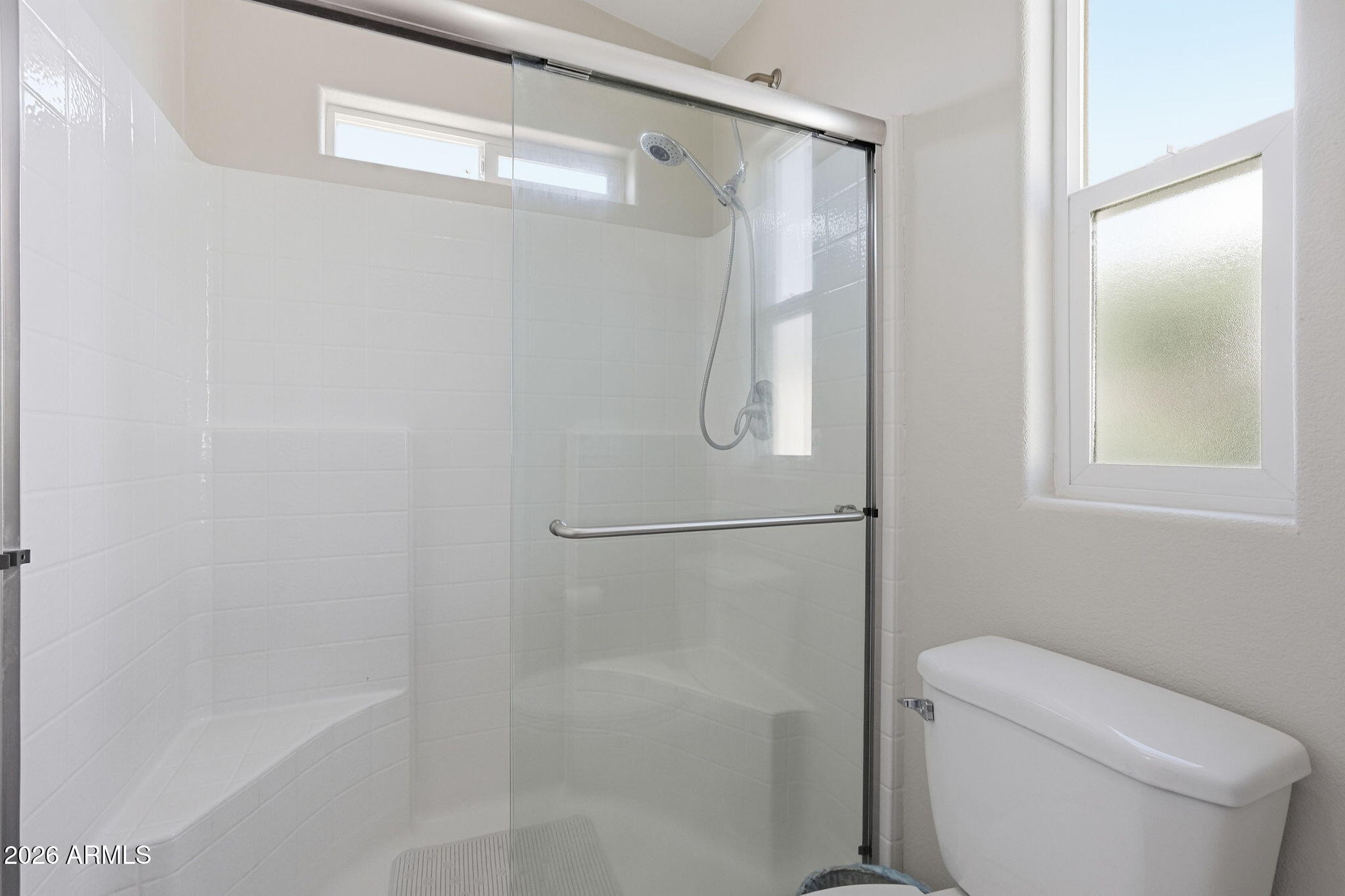 8865 East Baseline Road, Unit 1417 Mesa, AZ 85209 - Photo 21 of 47 a bathroom with a shower and toilet
