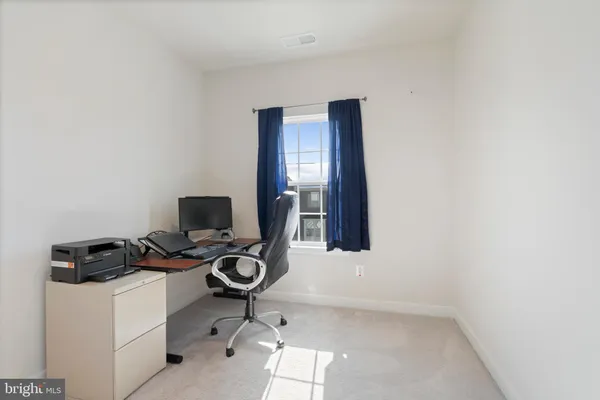 a room with furniture and white cabinet