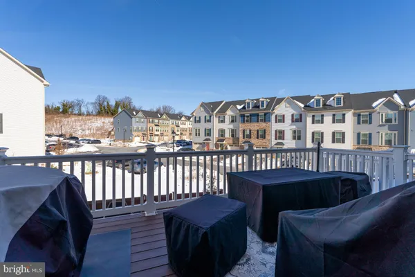 a view of a balcony with furniture