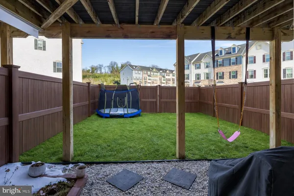 a balcony with a table and chairs