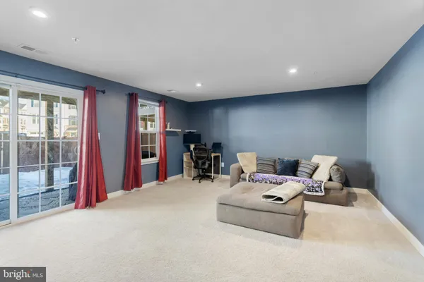 a room with furniture and a large window