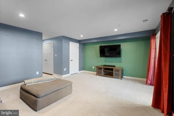 a living room with a flat screen tv and a fireplace