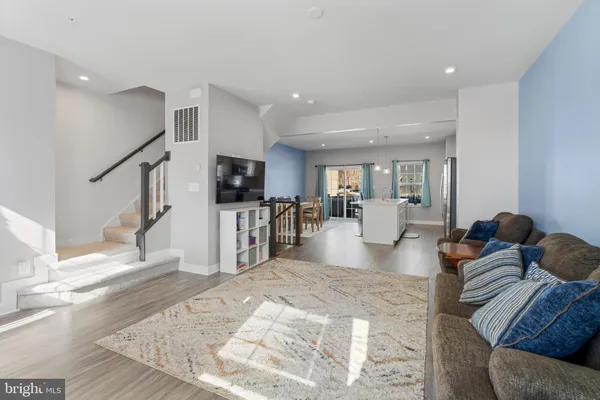 a living room with fireplace furniture and a flat screen tv