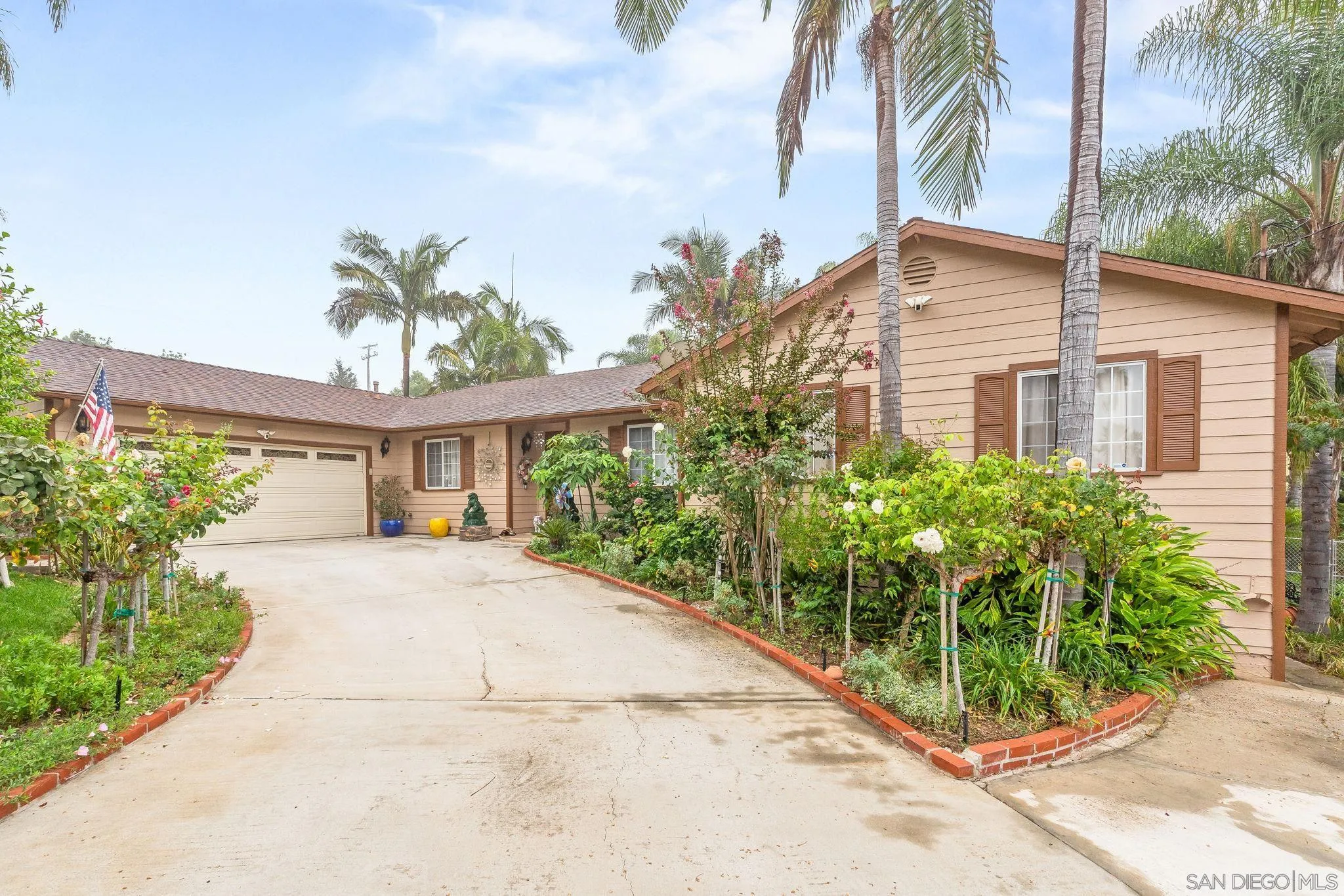 front view of a house with a garden