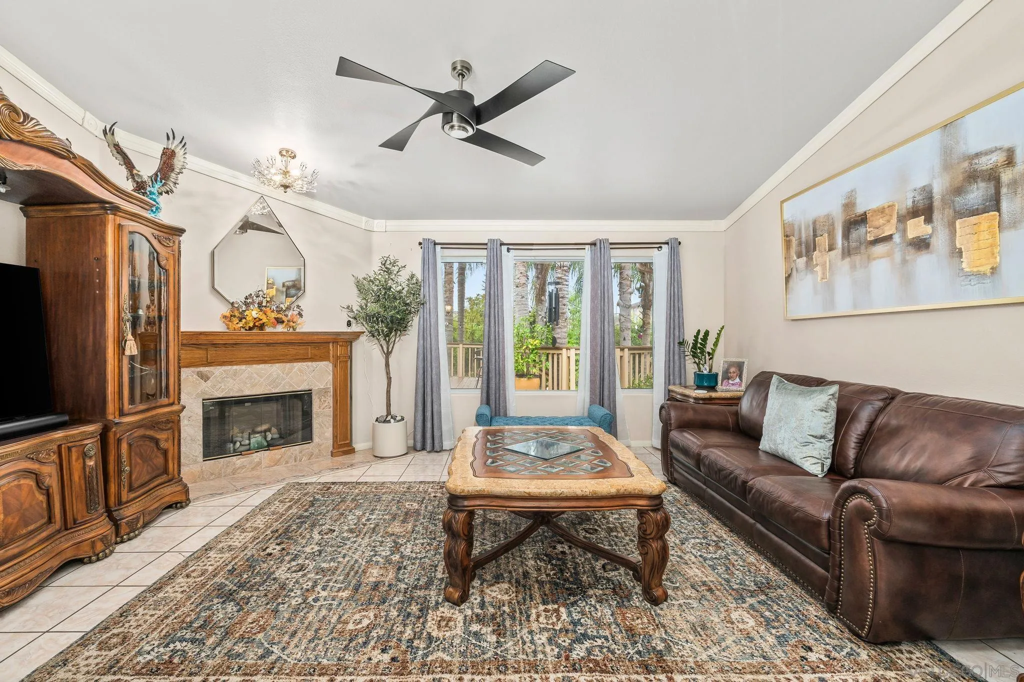 1451 Vía Lima Fallbrook, CA 92028 - Photo 12 of 41 a living room with furniture a fireplace and a flat screen tv