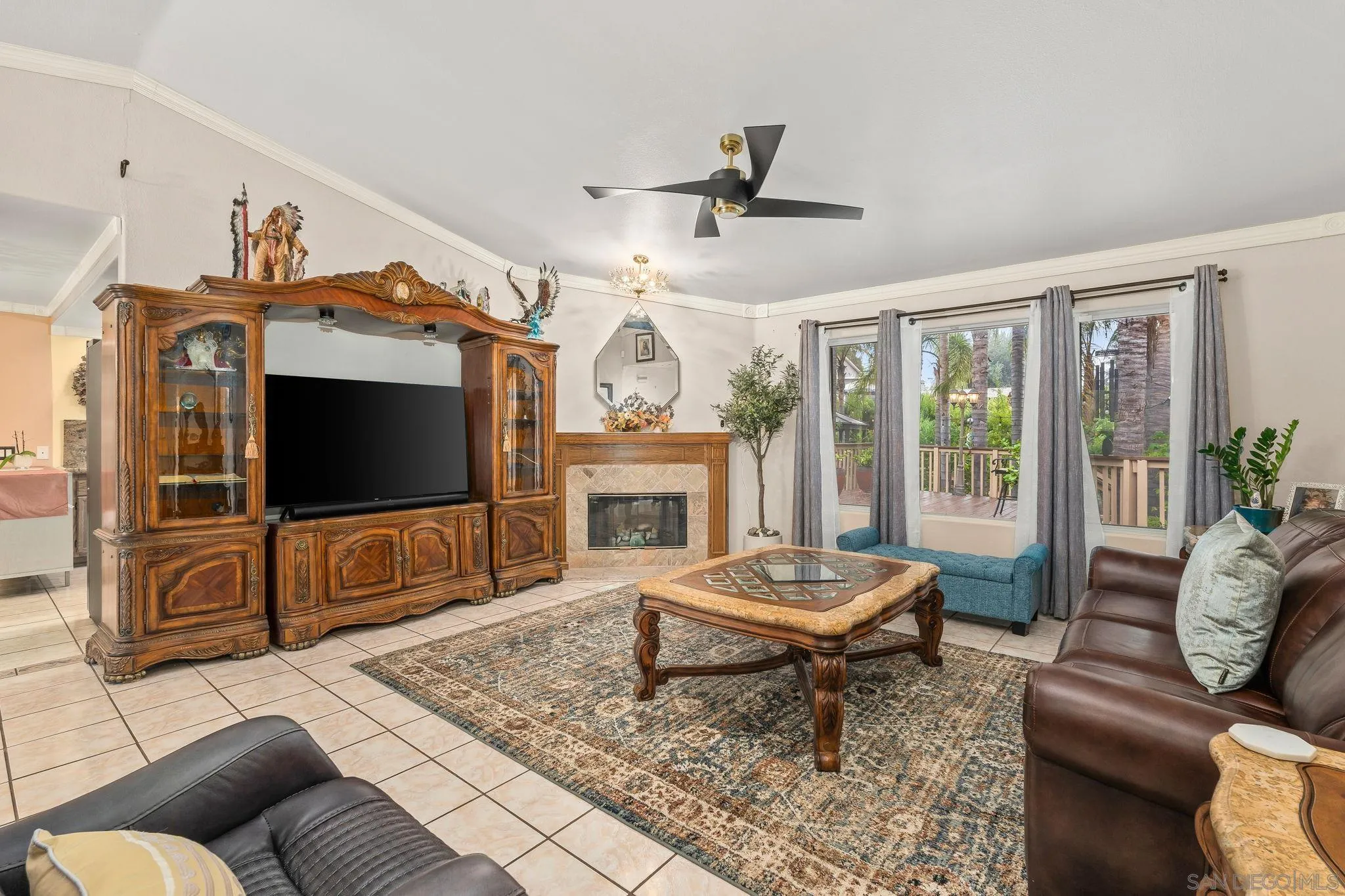 1451 Vía Lima Fallbrook, CA 92028 - Photo 14 of 41 a living room with furniture a flat screen tv and a fireplace
