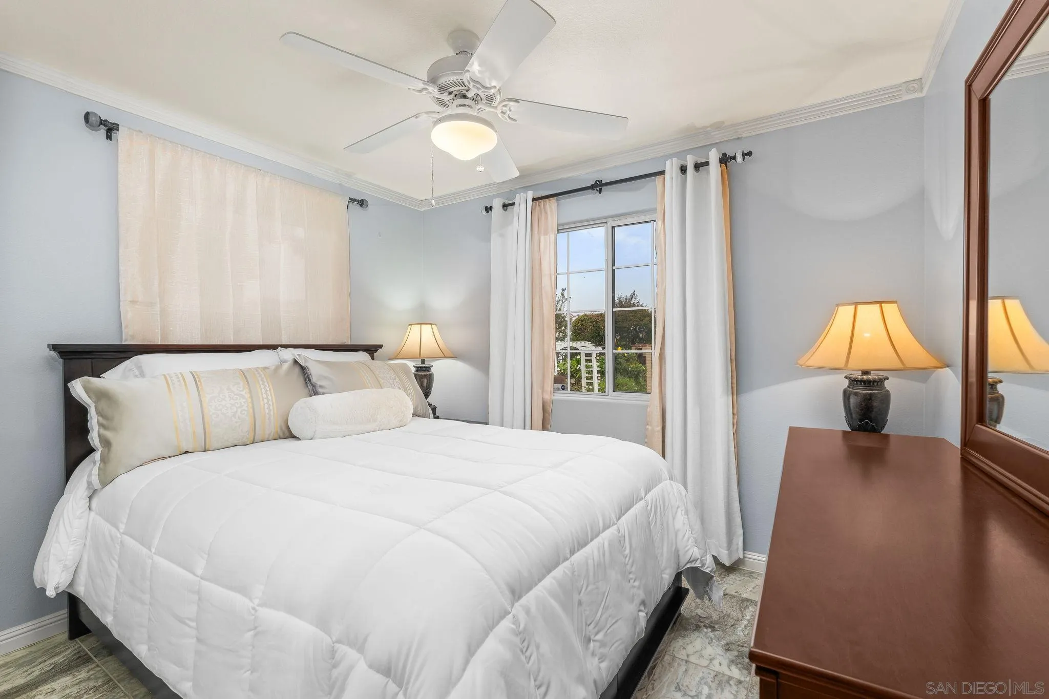 1451 Vía Lima Fallbrook, CA 92028 - Photo 19 of 41 a spacious bedroom with a bed and a chandelier