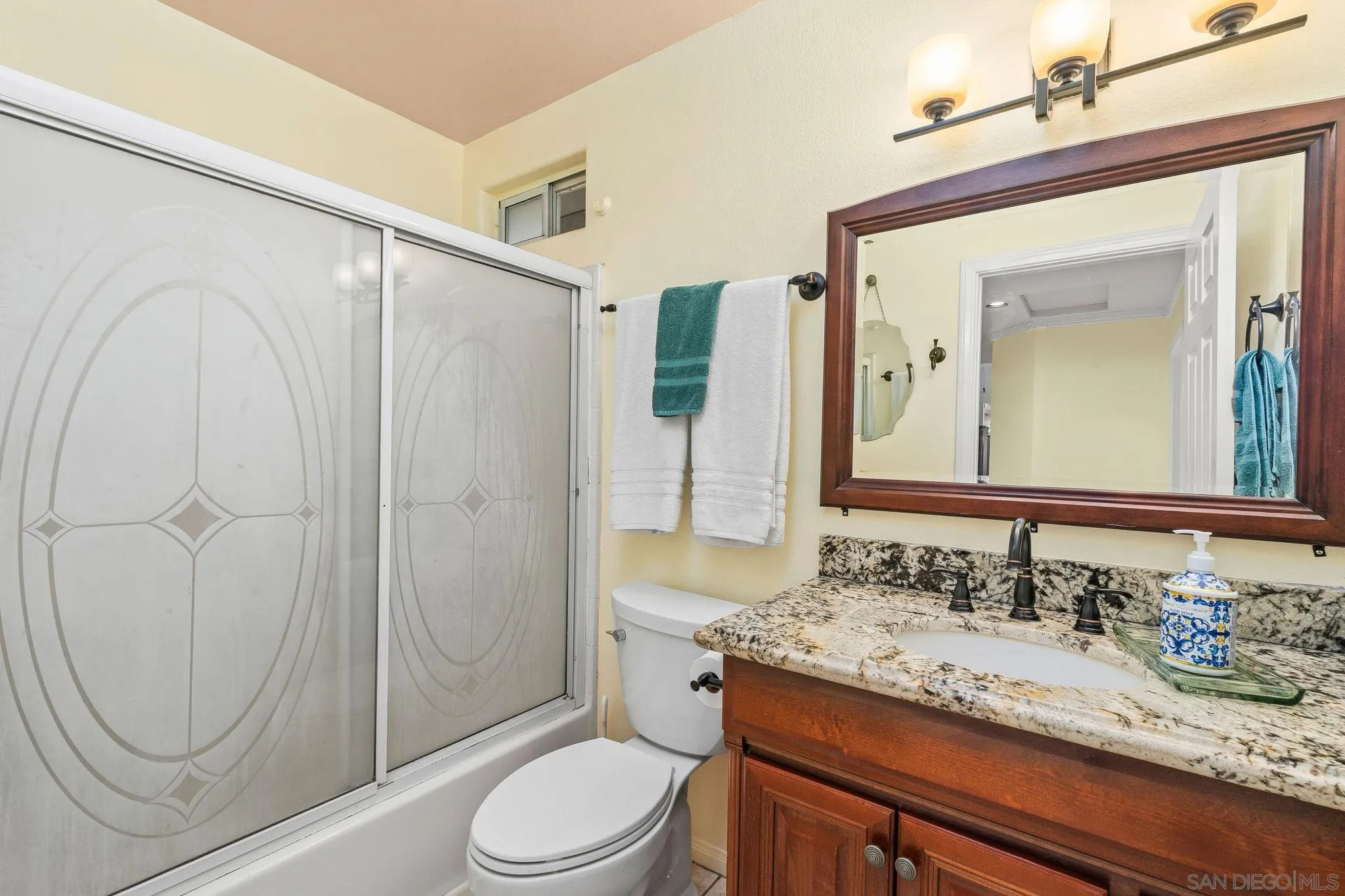 1451 Vía Lima Fallbrook, CA 92028 - Photo 23 of 41 a bathroom with a granite countertop sink toilet and shower