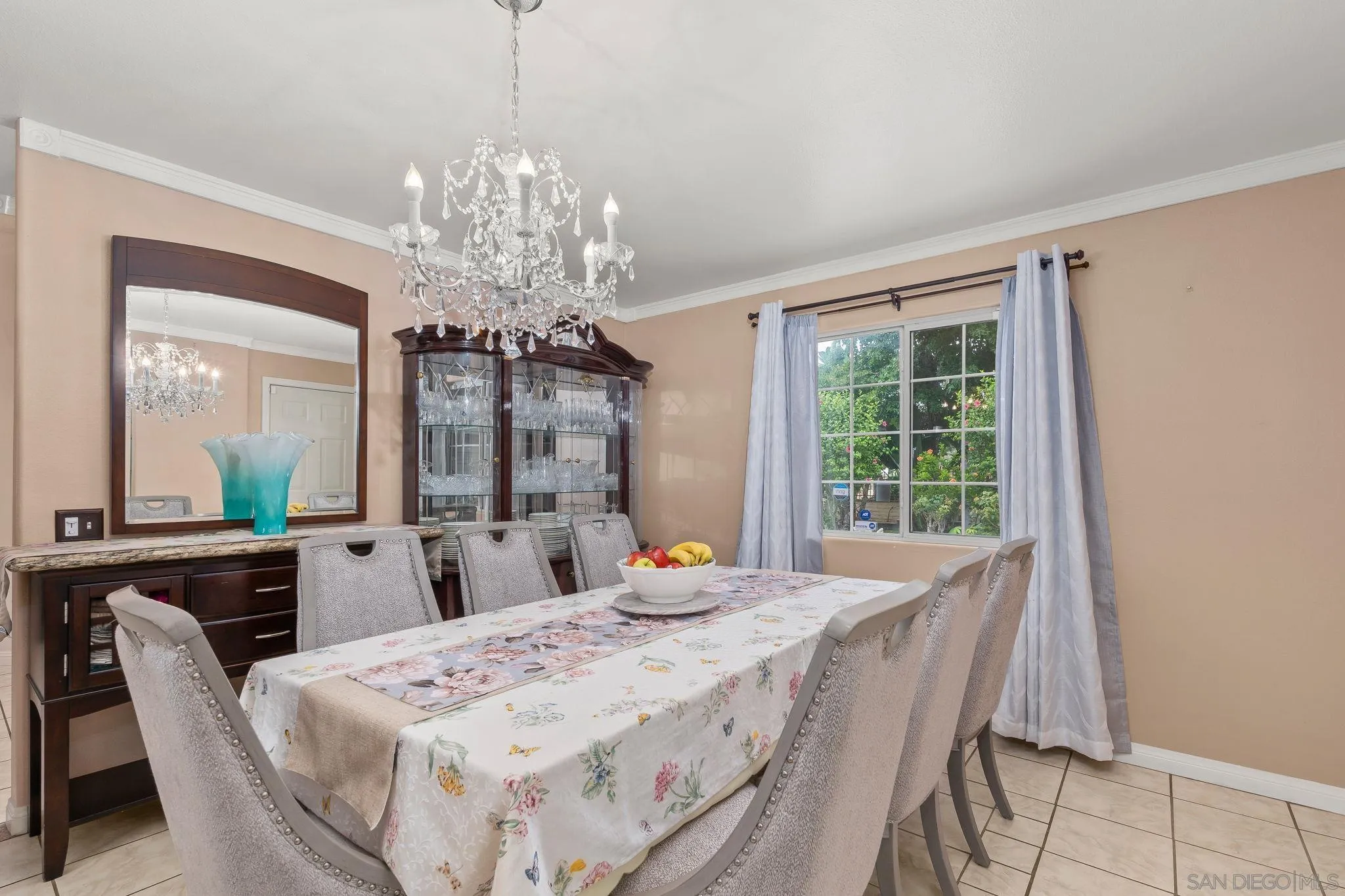 1451 Vía Lima Fallbrook, CA 92028 - Photo 26 of 41 a bedroom with a bed and a chandelier