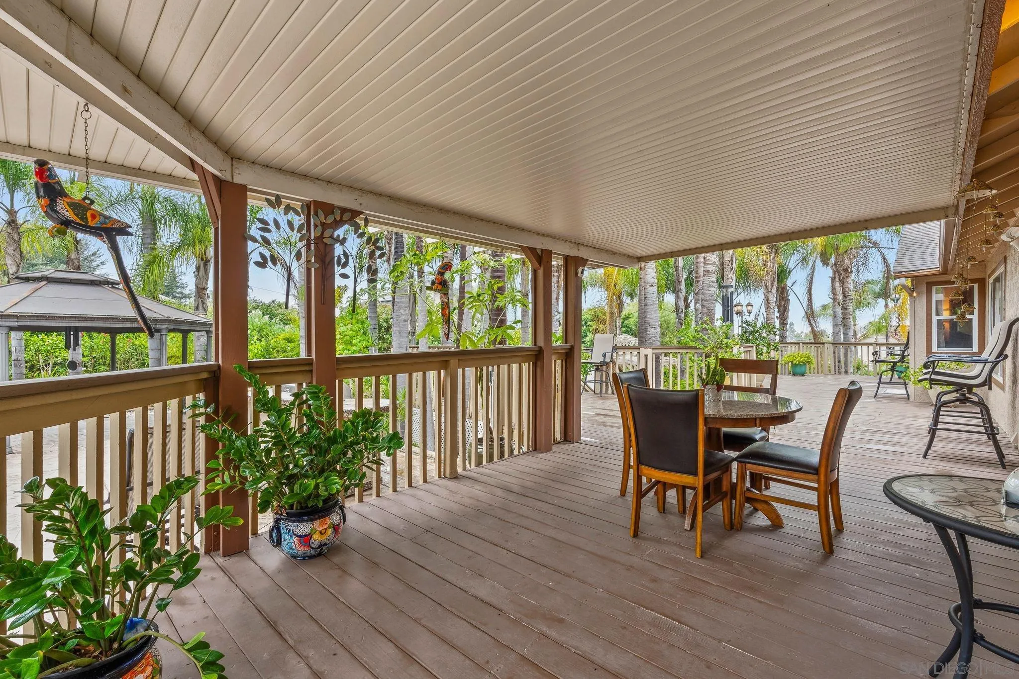 1451 Vía Lima Fallbrook, CA 92028 - Photo 31 of 41 a view of a dining room with furniture window and wooden floor