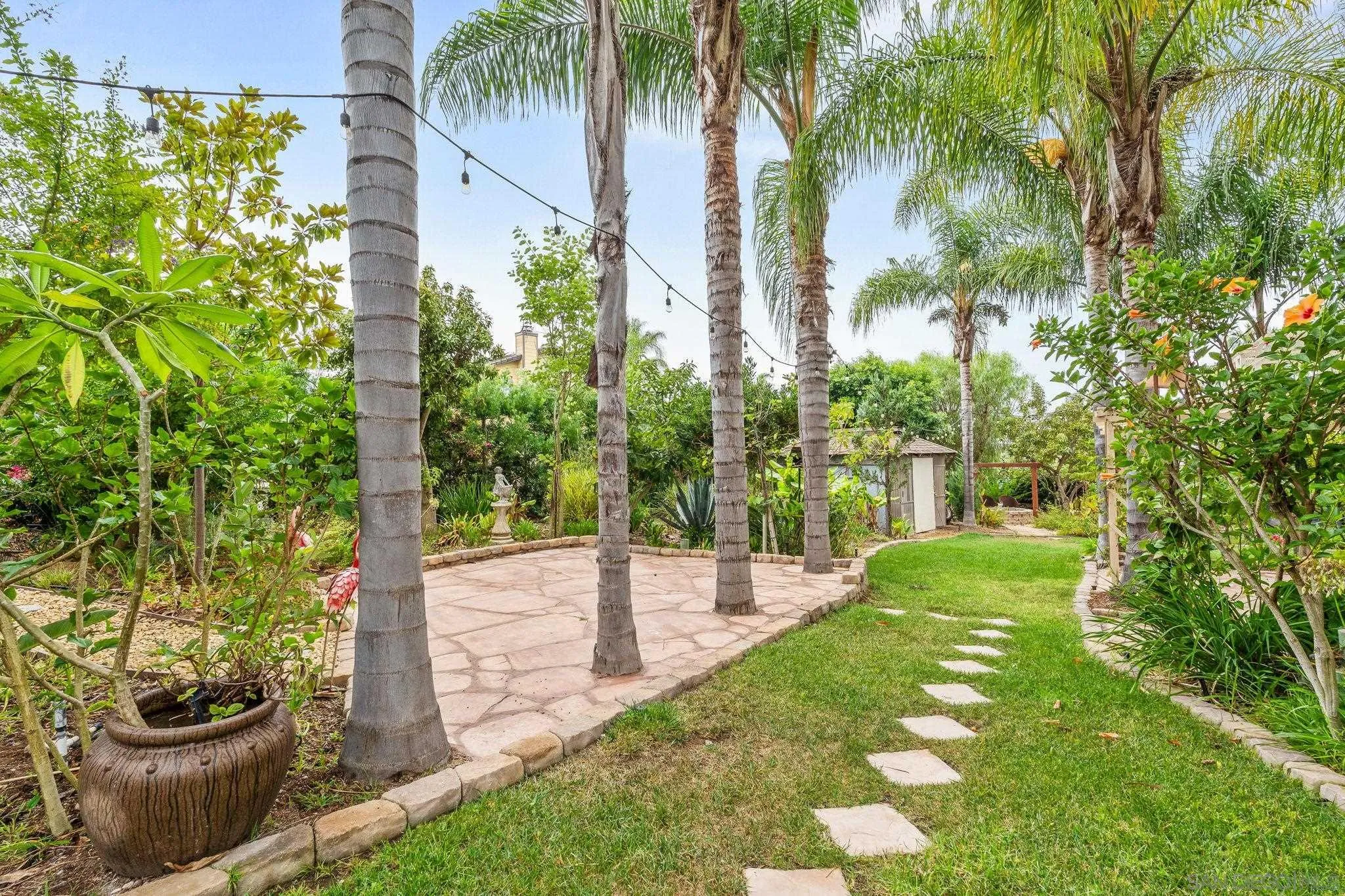 1451 Vía Lima Fallbrook, CA 92028 - Photo 36 of 41 a view of a yard with plants and a fountain