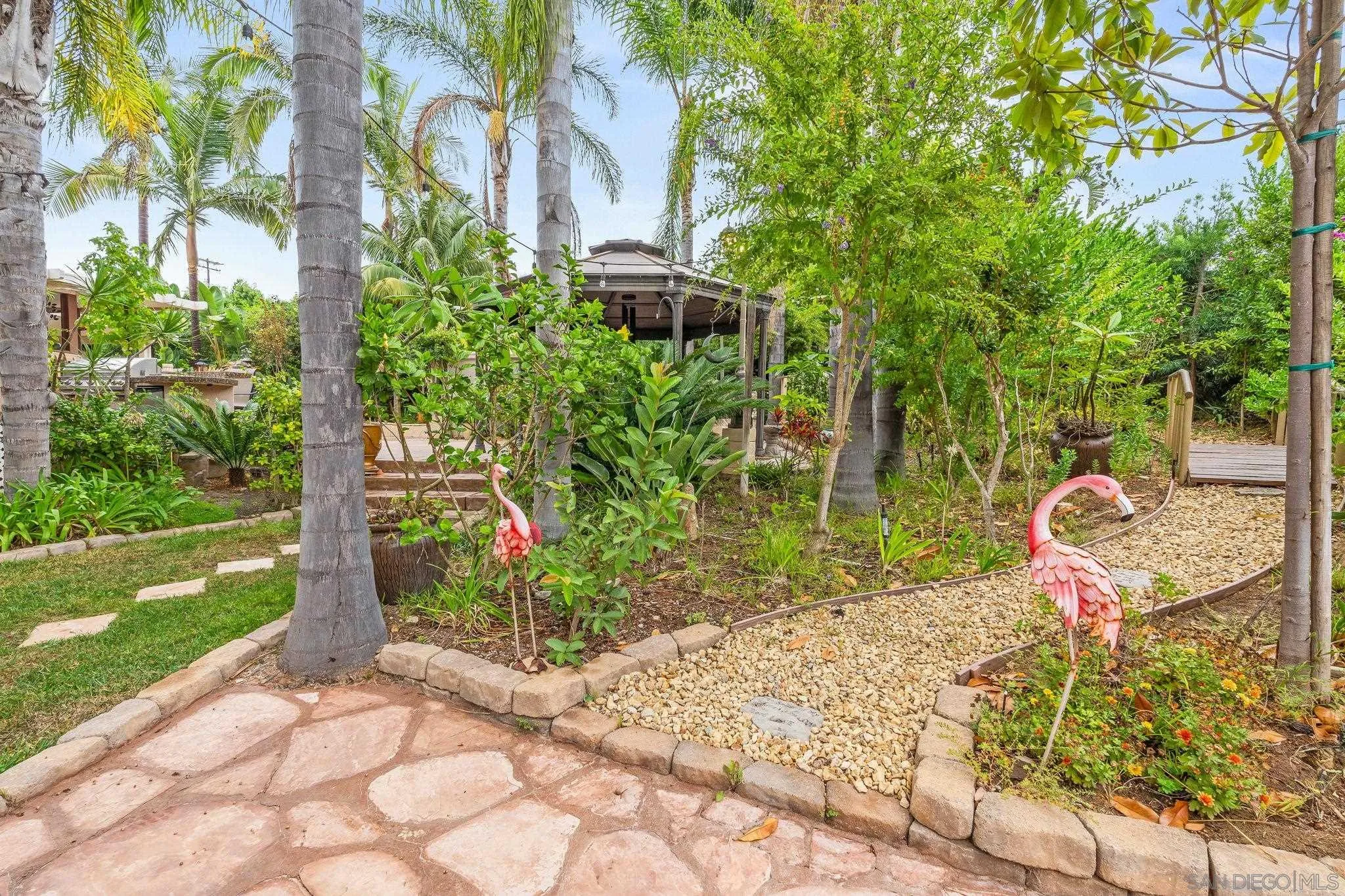 1451 Vía Lima Fallbrook, CA 92028 - Photo 37 of 41 a view of a back yard with flower plants and garden