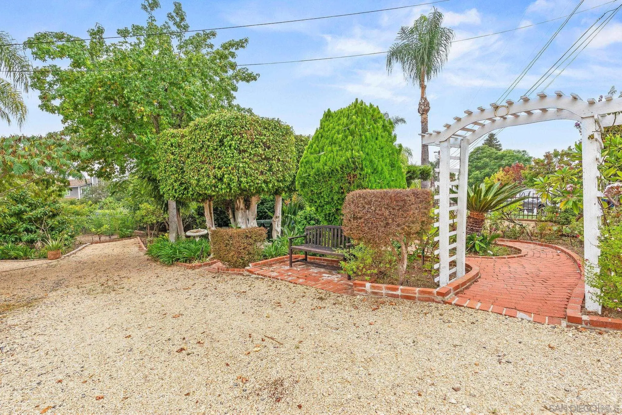 1451 Vía Lima Fallbrook, CA 92028 - Photo 7 of 41 a view of a chair and table in front of a house