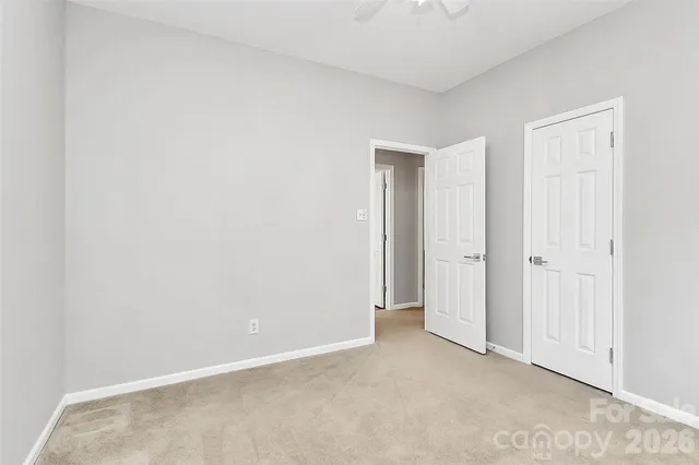an empty room with closet area