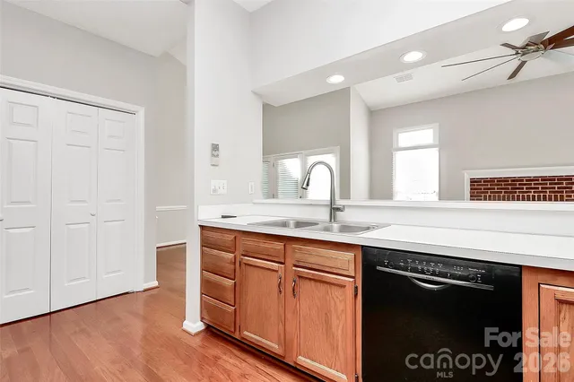 a kitchen with a sink and cabinets