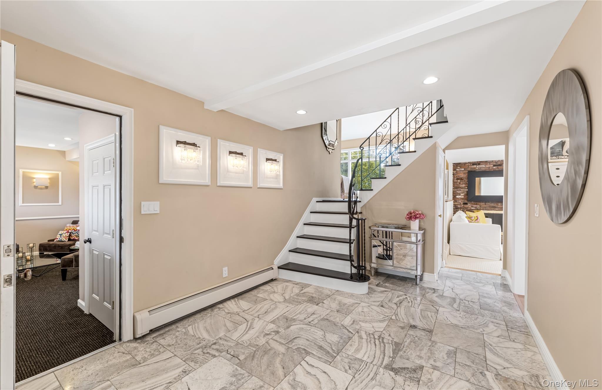 22 Delaware Avenue Jericho, NY 11753 - Photo 12 of 35 a view of entryway with livingroom and stairs