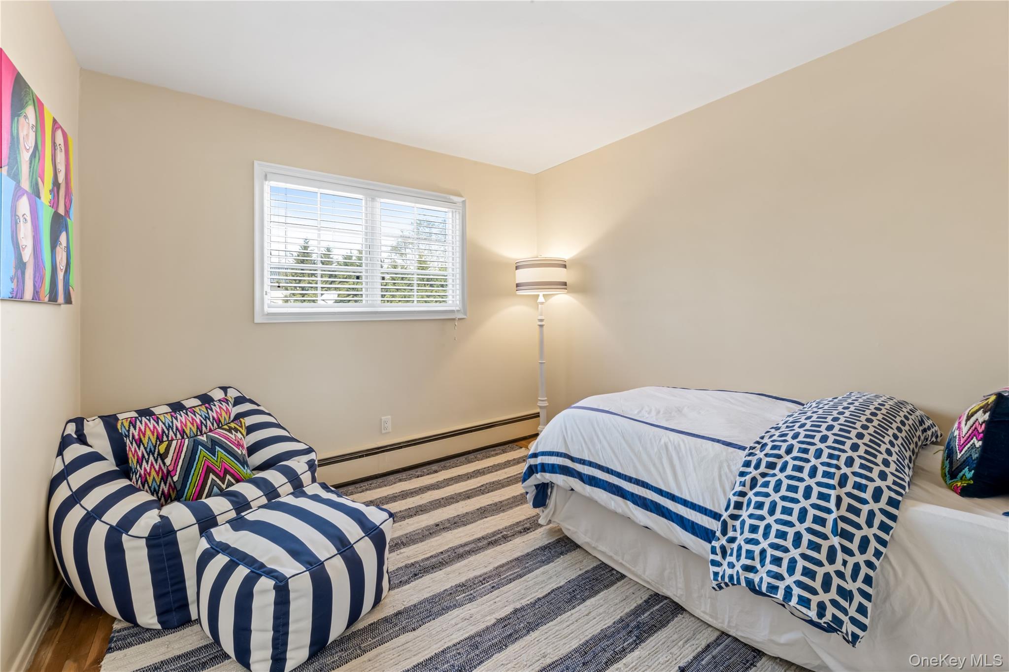 22 Delaware Avenue Jericho, NY 11753 - Photo 24 of 35 a bedroom with a bed and a window