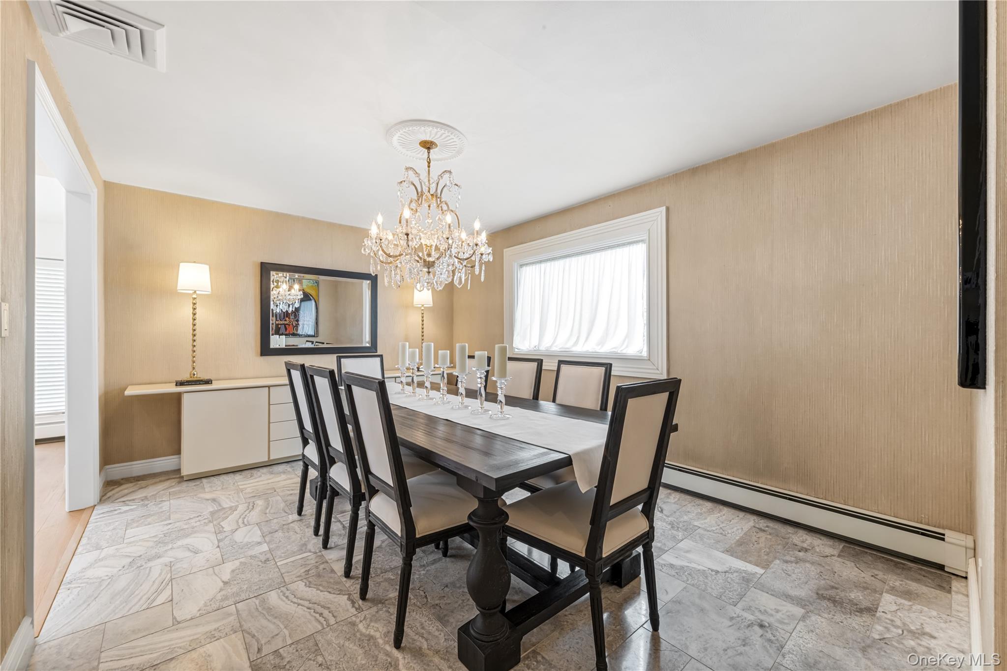 22 Delaware Avenue Jericho, NY 11753 - Photo 8 of 35 a view of a dining room with furniture and chandelier