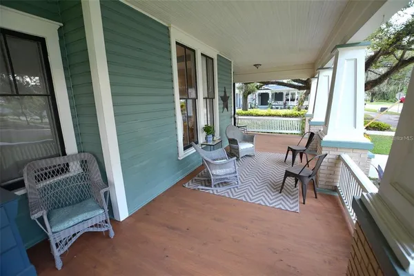 a view of a patio with a yard