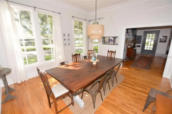 a bedroom with furniture and wooden floor