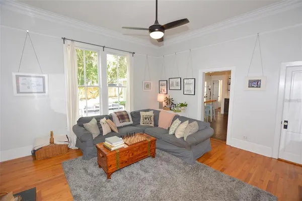 a bedroom with furniture and a window