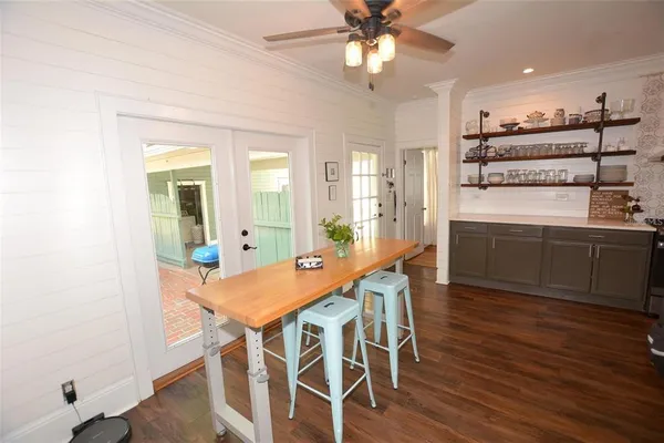a bedroom with furniture and a book shelf