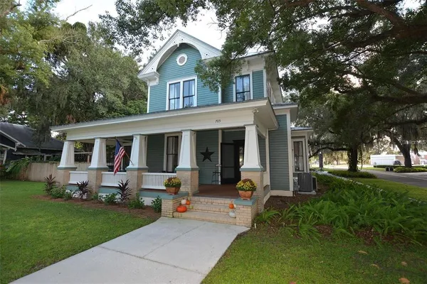 a front view of house with yard and green space