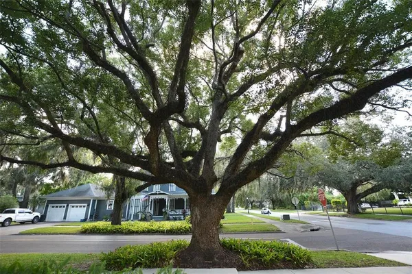 a front view of a house with a yard table and chairs