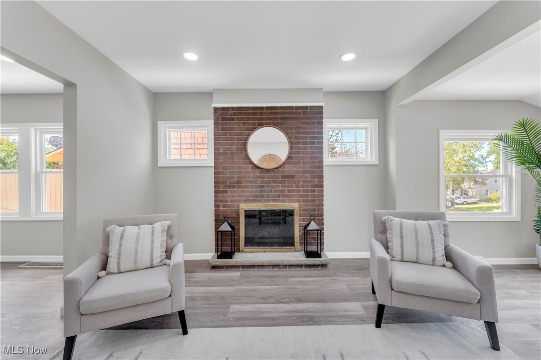 4124 Bayard Road Cleveland, OH 44121 - Photo 8 of 35 Sitting room featuring a fireplace, recessed lighting, and wood finished floors