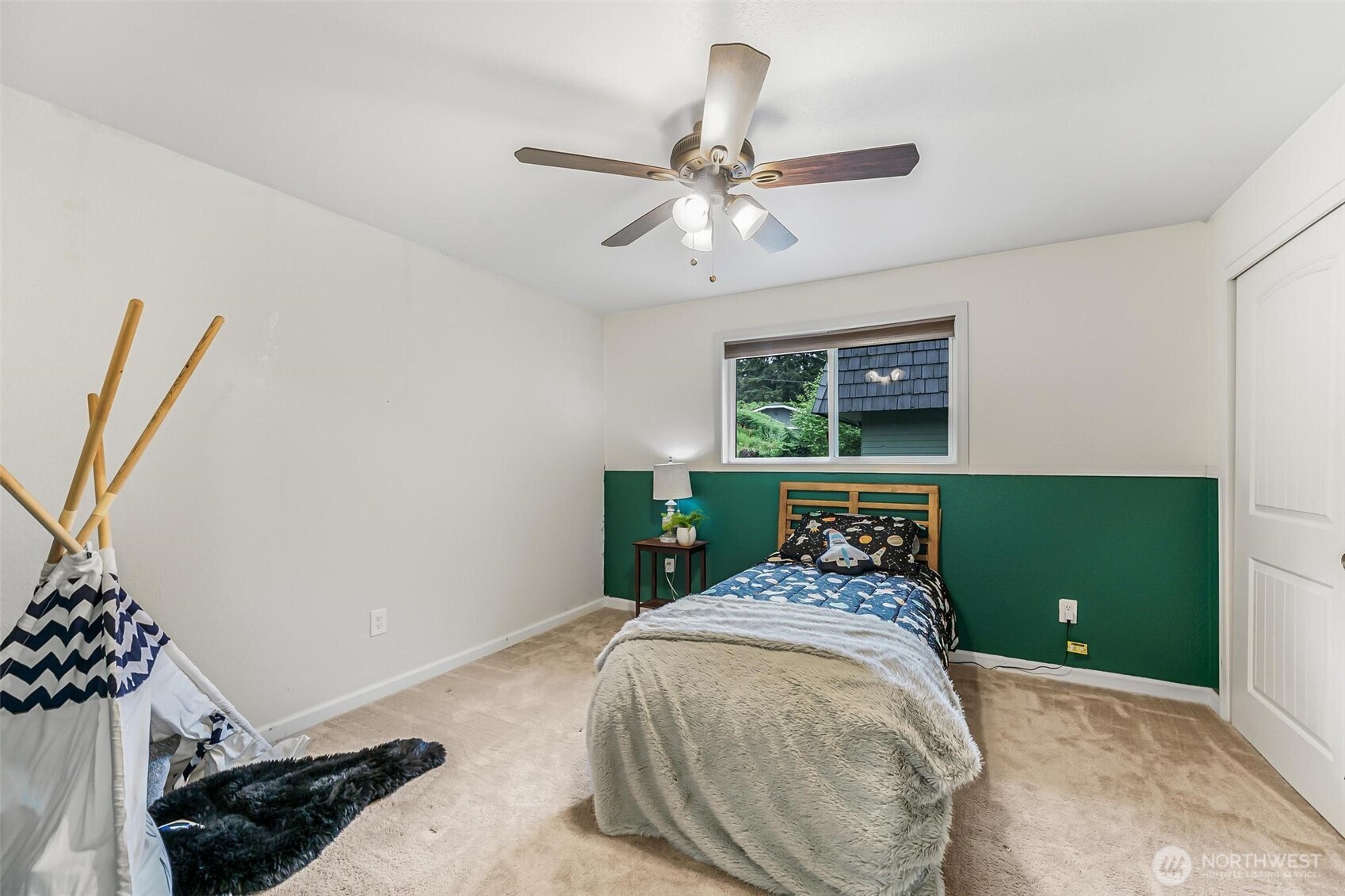 11404 Karshner Road East Edgewood, WA 98372 - Photo 24 of 40 a bedroom with a bed and a window