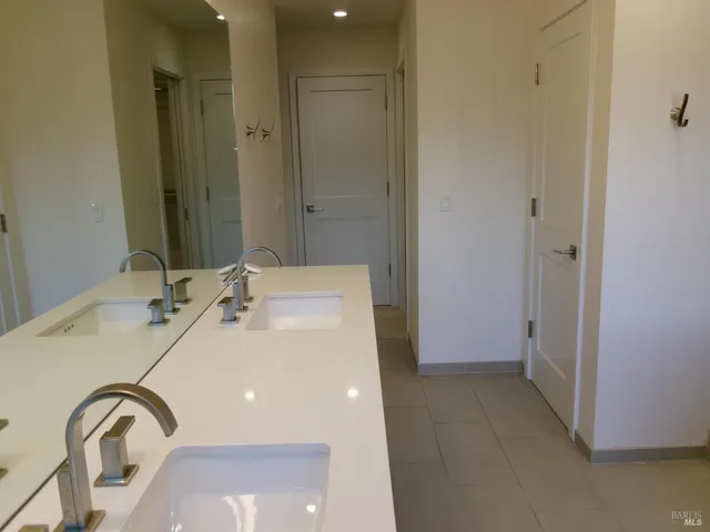 a spacious bathroom with a sink and shower