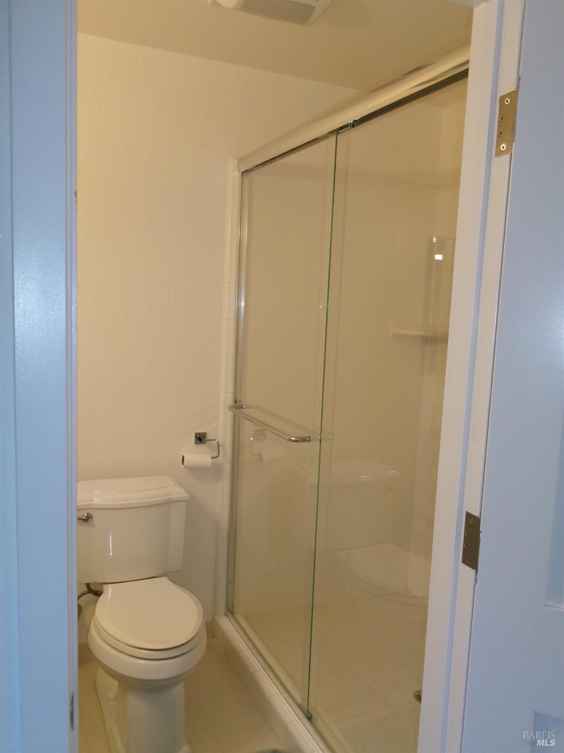 6416 Timber Springs Court Santa Rosa, CA 95409 - Photo 16 of 27 a white toilet sitting next to a shower