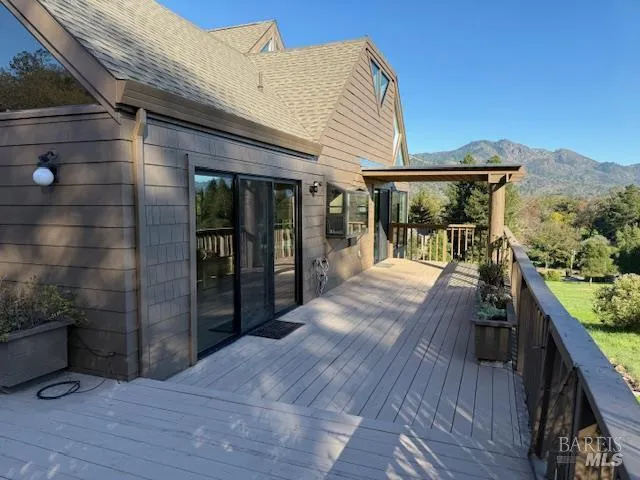 a view of a patio with wooden floor and outer view