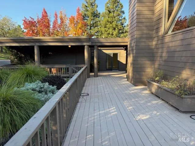 a balcony with wooden floor