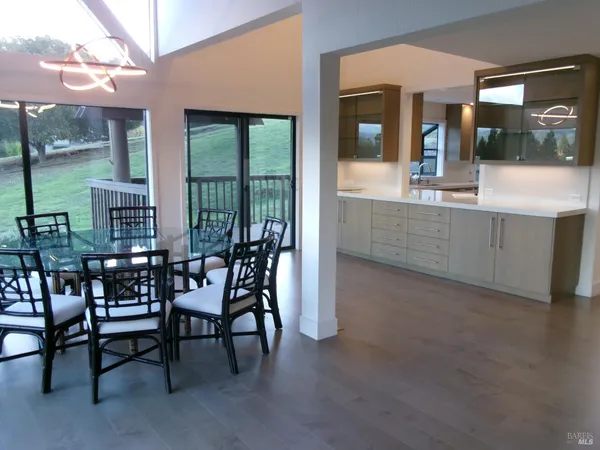 a dining room with furniture and window