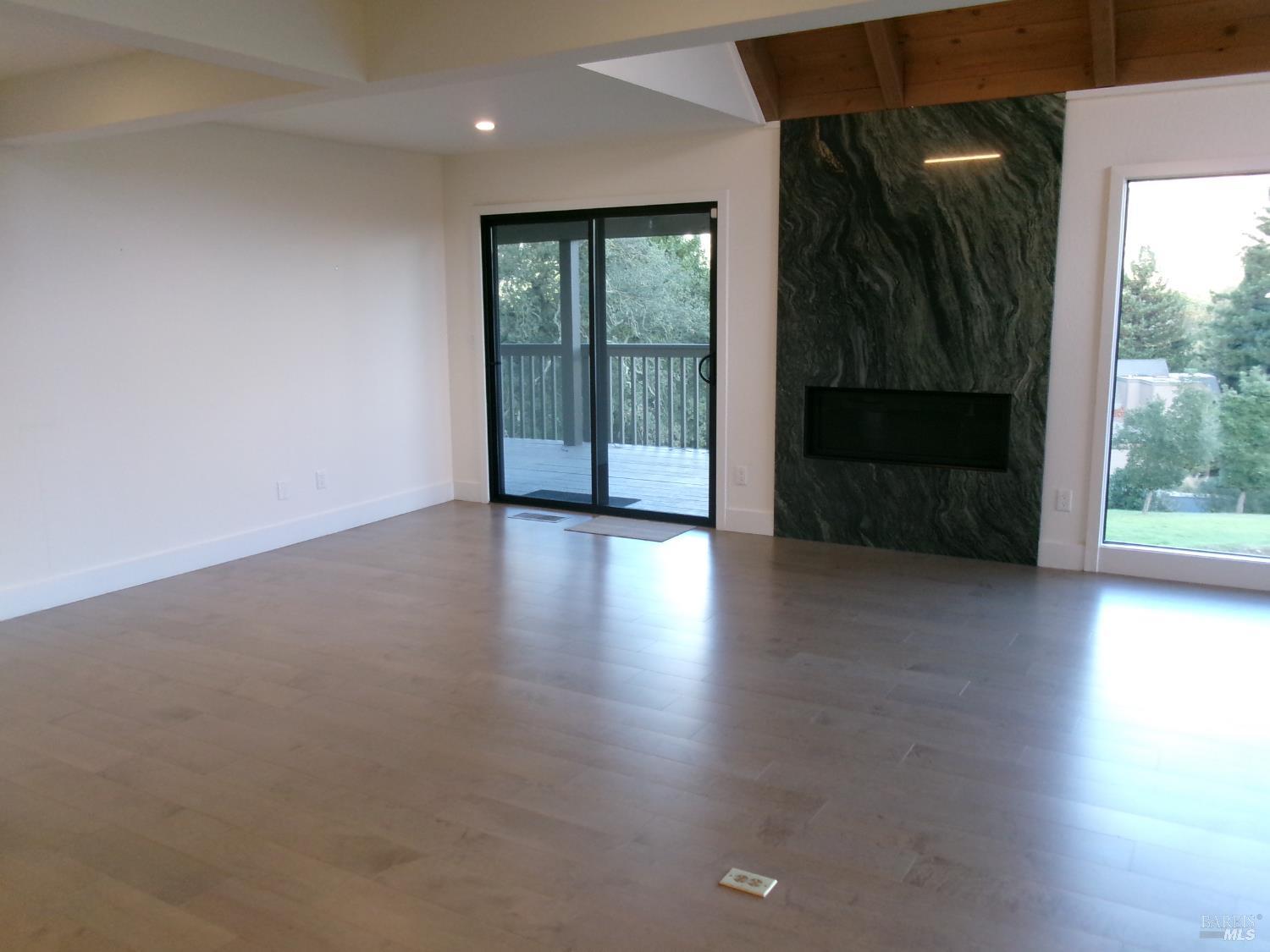 6416 Timber Springs Court Santa Rosa, CA 95409 - Photo 6 of 27 wooden floor in an empty room with a window
