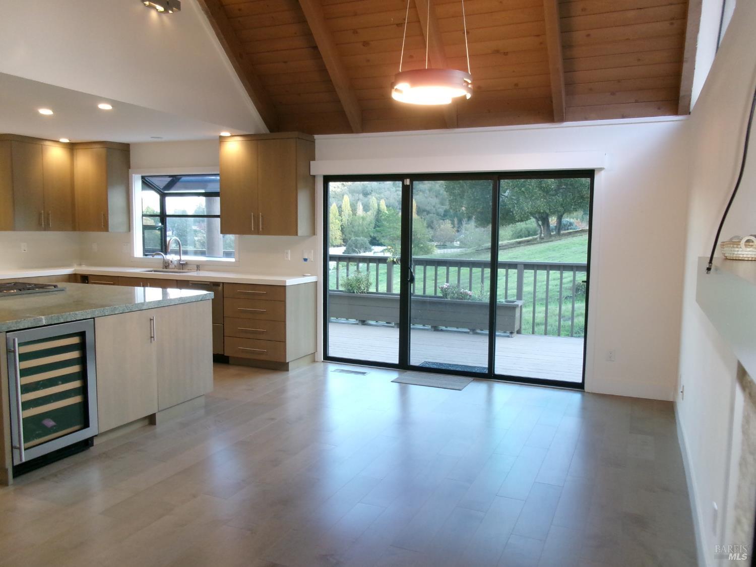 6416 Timber Springs Court Santa Rosa, CA 95409 - Photo 10 of 27 a view of a kitchen with a sink wooden cabinets and a window