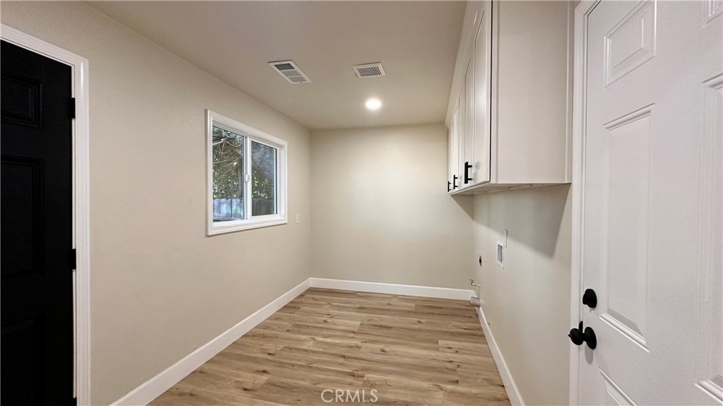2404 Miller Avenue Modesto, CA 95354 - Photo 14 of 15 a view of a room with window and hardwood floor