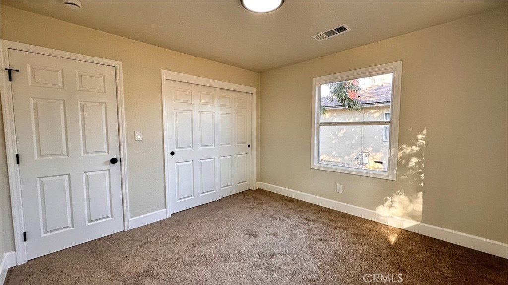 2404 Miller Avenue Modesto, CA 95354 - Photo 9 of 15 an empty room with windows