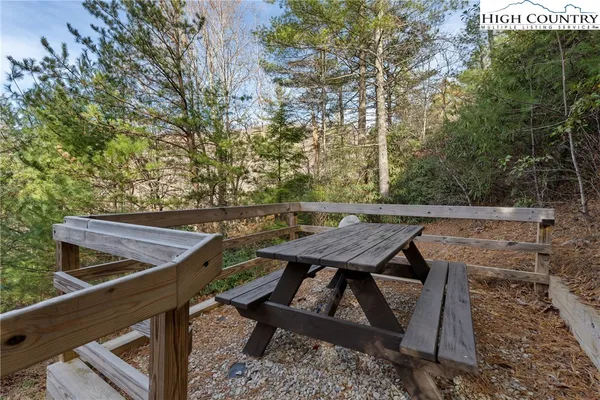 a view of a chairs and table on the deck