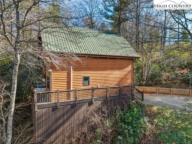 a view of a lush green hillside and houses