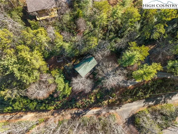 a backyard of a house with a yard with outdoor seating