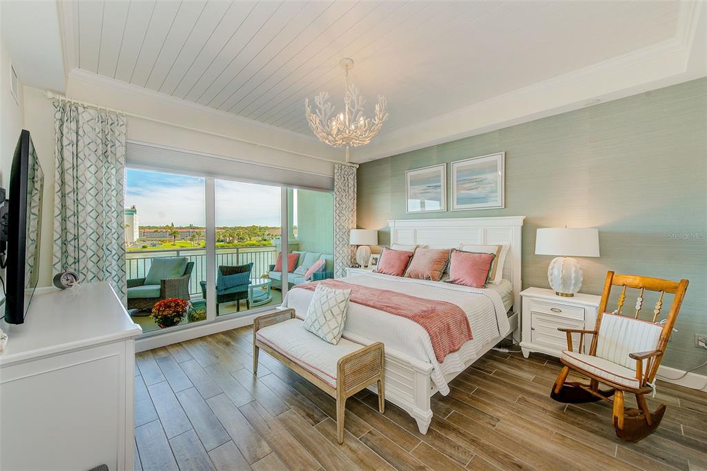 20001 Gulf Boulevard, Unit 403 Indian Shores, FL 33785 - Photo 13 of 43 a living room with furniture a fireplace and a flat screen tv