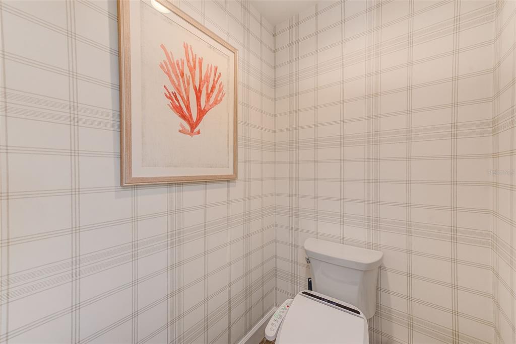 20001 Gulf Boulevard, Unit 403 Indian Shores, FL 33785 - Photo 18 of 43 a bathroom with a toilet and a shower