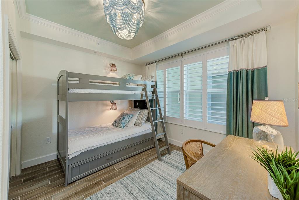 20001 Gulf Boulevard, Unit 403 Indian Shores, FL 33785 - Photo 22 of 43 a bedroom with furniture and a window