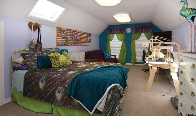 a view of a chairs and table on the roof deck